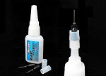 Sweep EXP 100% CA tire glue with metal nozzle.